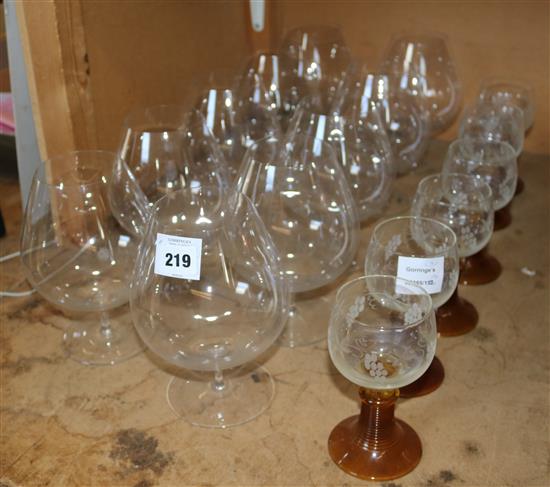 Set of six Dutch amber glass stemmed roemers and a set of ten very large brandy balloons(-)